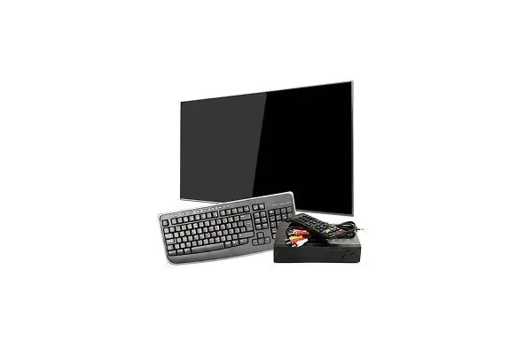 Electronic items including a flat-screen monitor, a gray computer keyboard, a black remote control, and a black electronic device arranged together with a red prohibition symbol over them, indicating these items are not allowed for recycling in standard collection bins. 