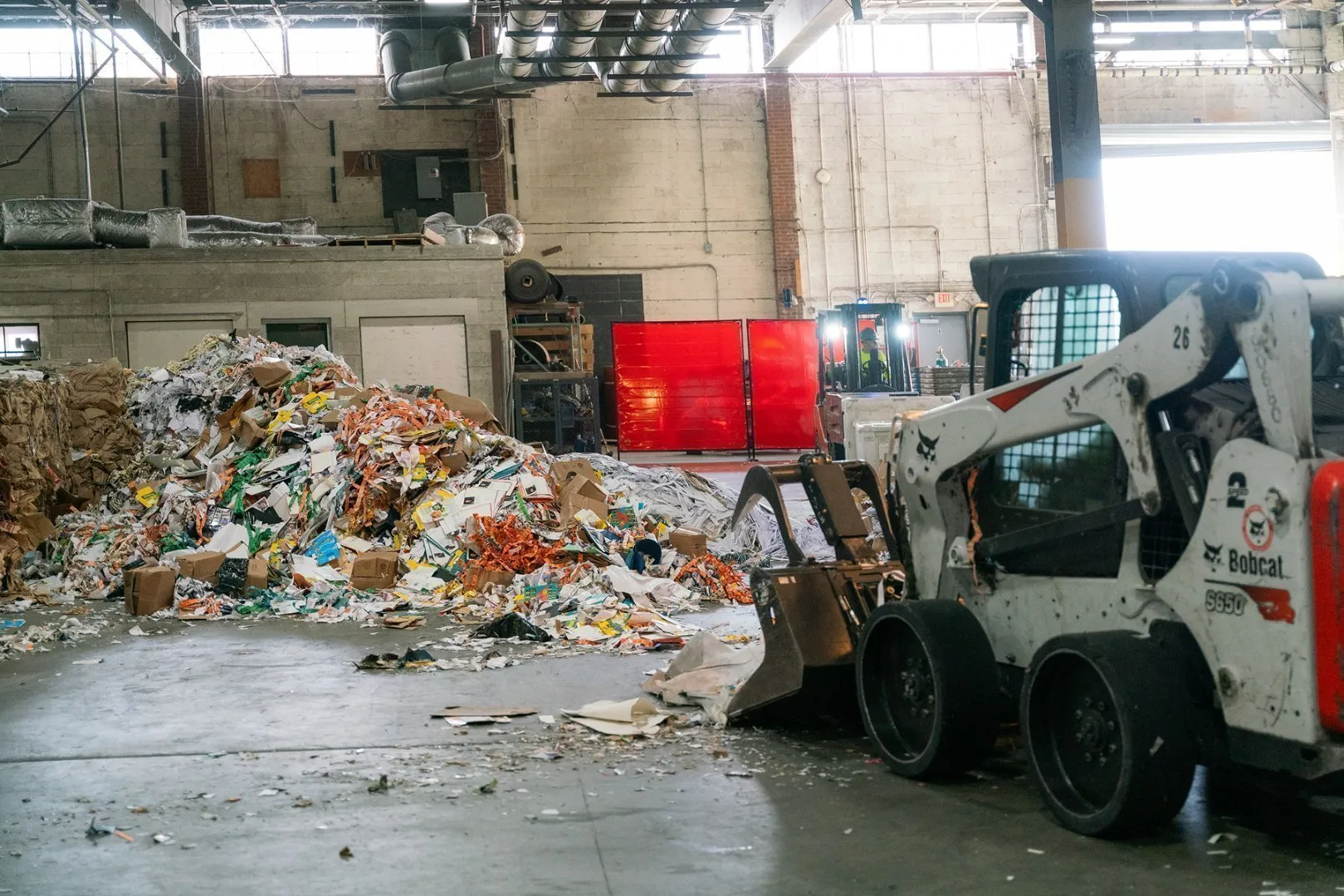 A Casella recycle facility with a forklift moving the recycled products