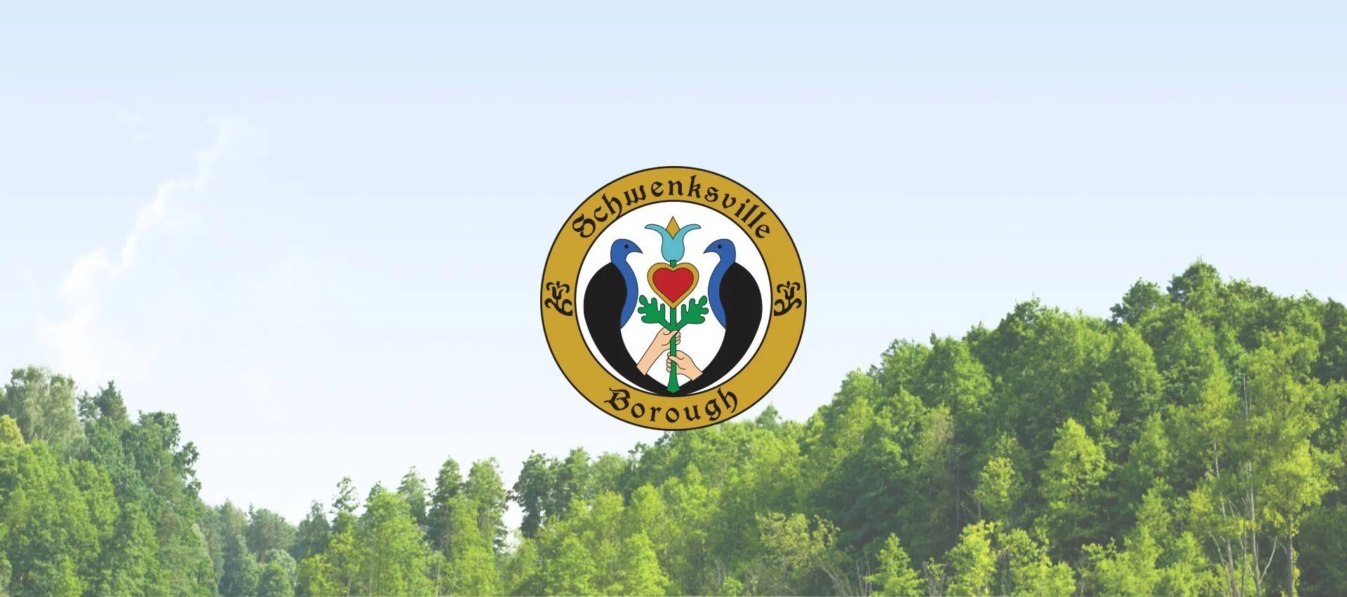 Schwenksville Borough seal centered above a green forested landscape beneath a pale blue sky.