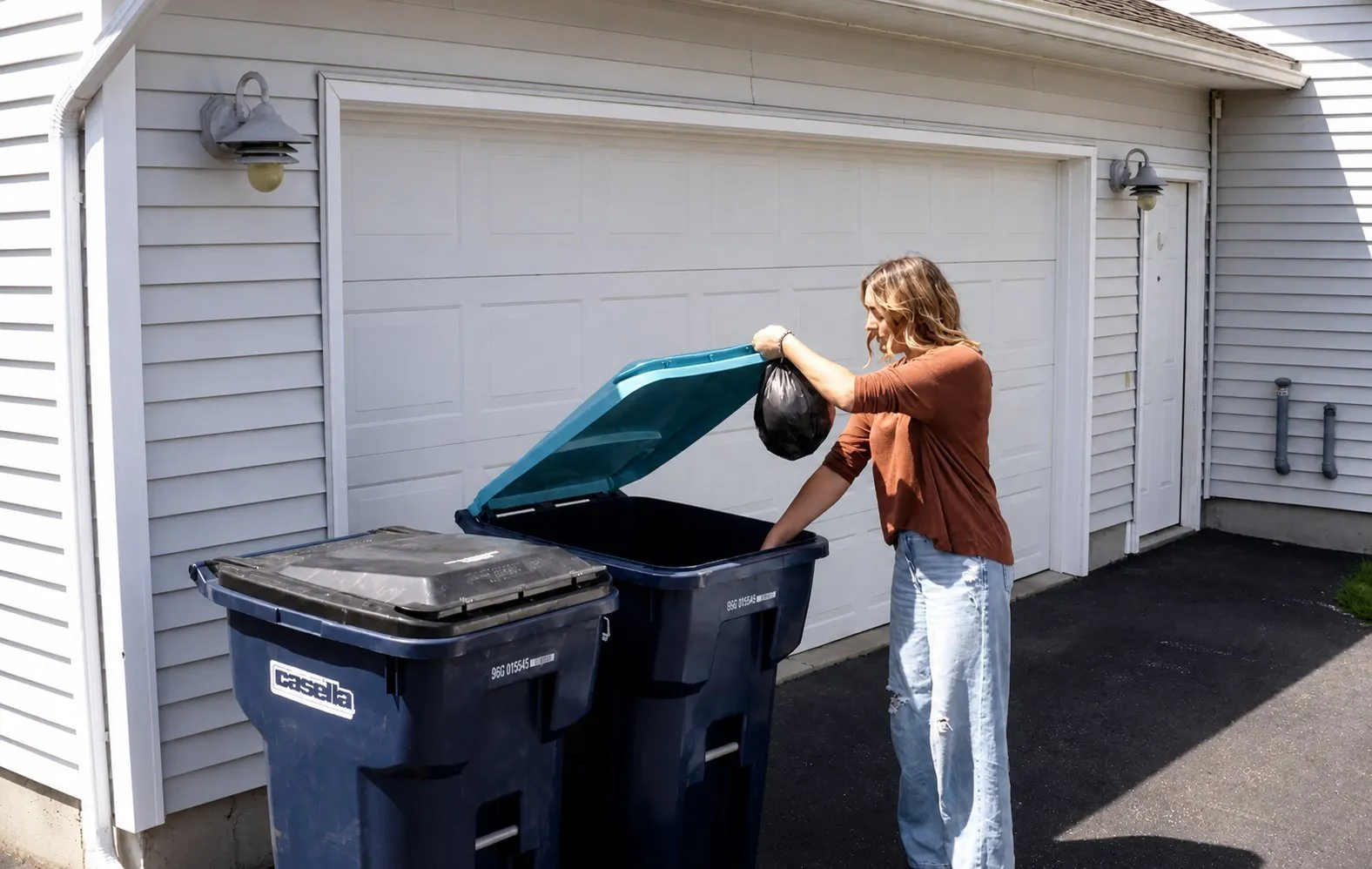 Demonstration of proper placement of waste and recycling carts at the curb for Casella residential pickup, ensuring safe and efficient collection.