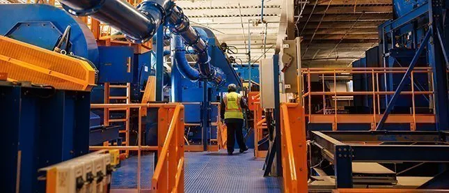 A worker in a Casella recycling facility
